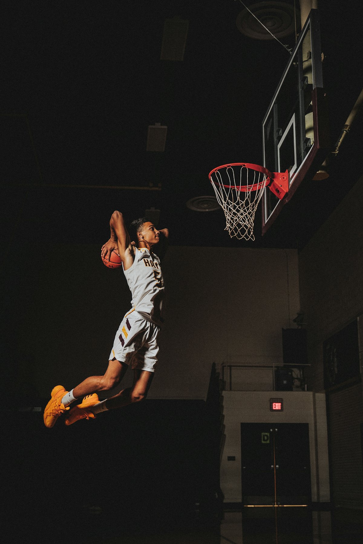 A young athlete rising toward the rim